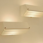 Pair of large white lacquered wall lights with shutters by Jacques Biny