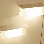 Pair of grey lacquered perforated wall light with perspex by Jacques Biny